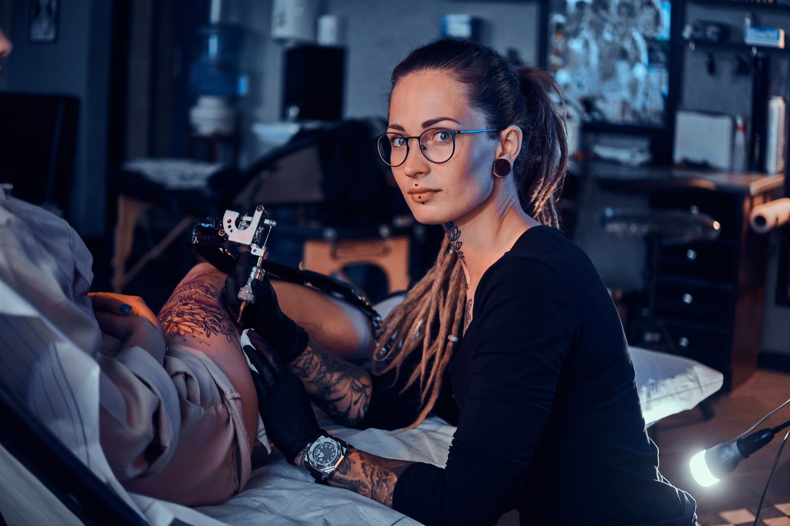 Tattoo studio with artist and client